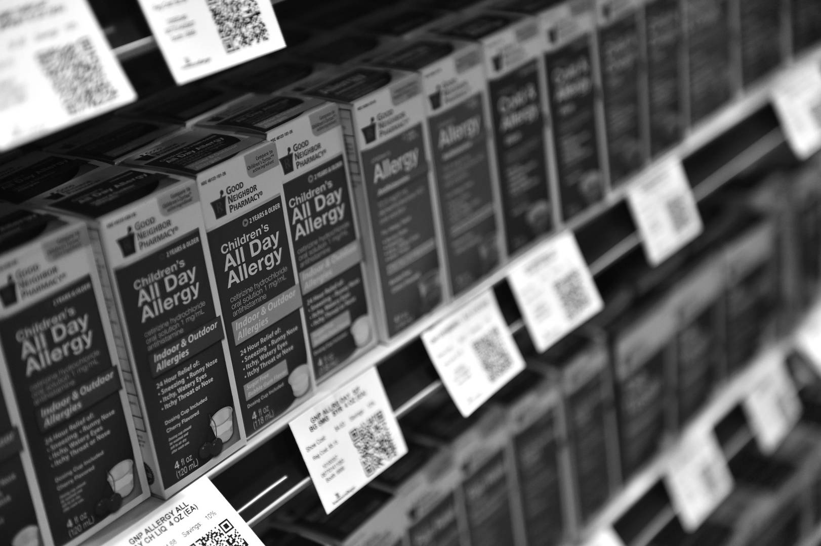 Pharmacy shelves filled with Good Neighbor Pharmacy brand OTC allergy medication