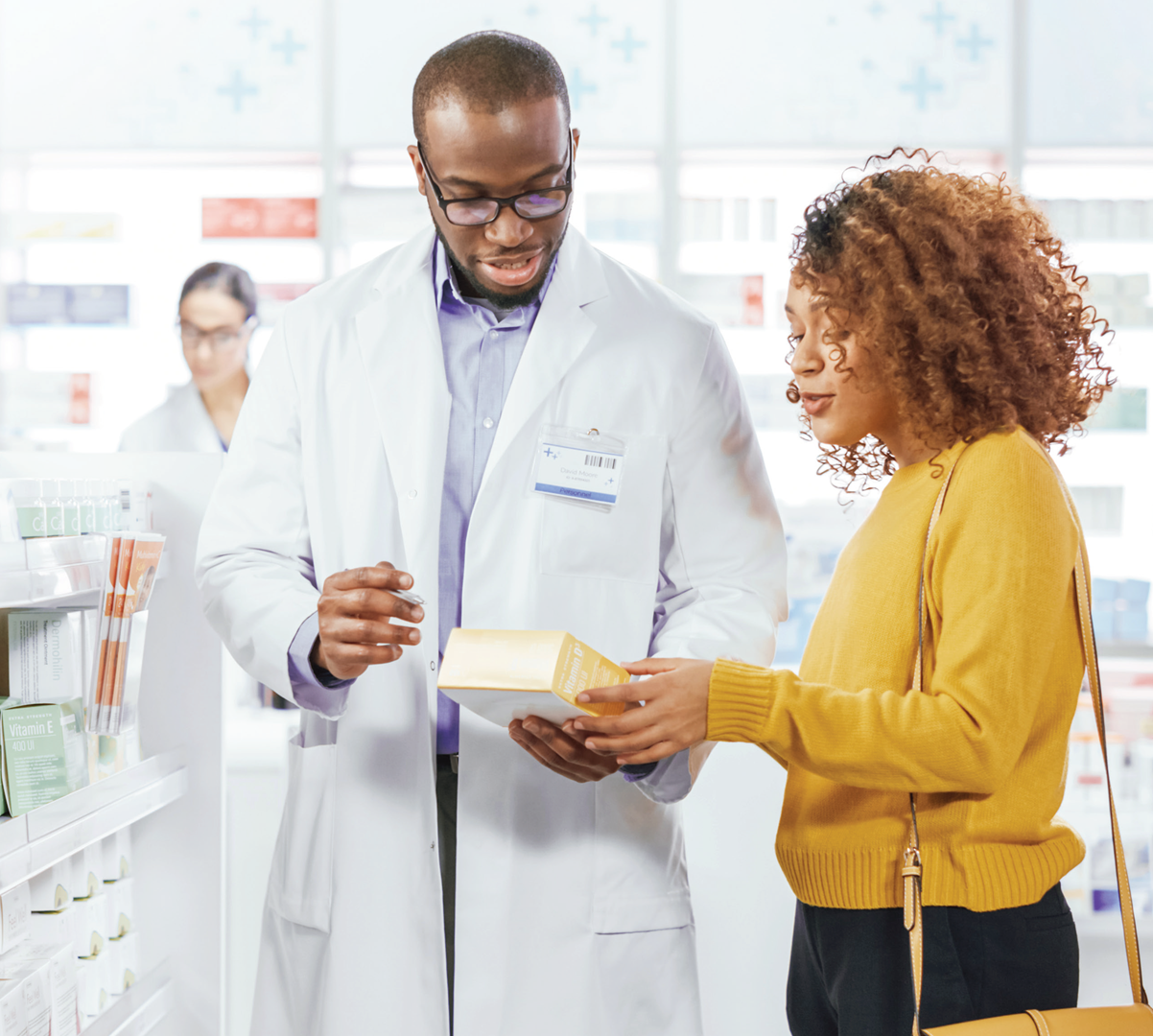 A pharmacist educating a patient about an over-the-counter product