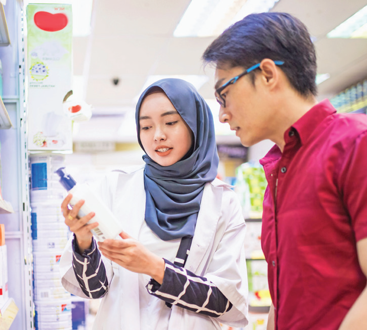 A pharmacist helping a patient select an over-the-counter item